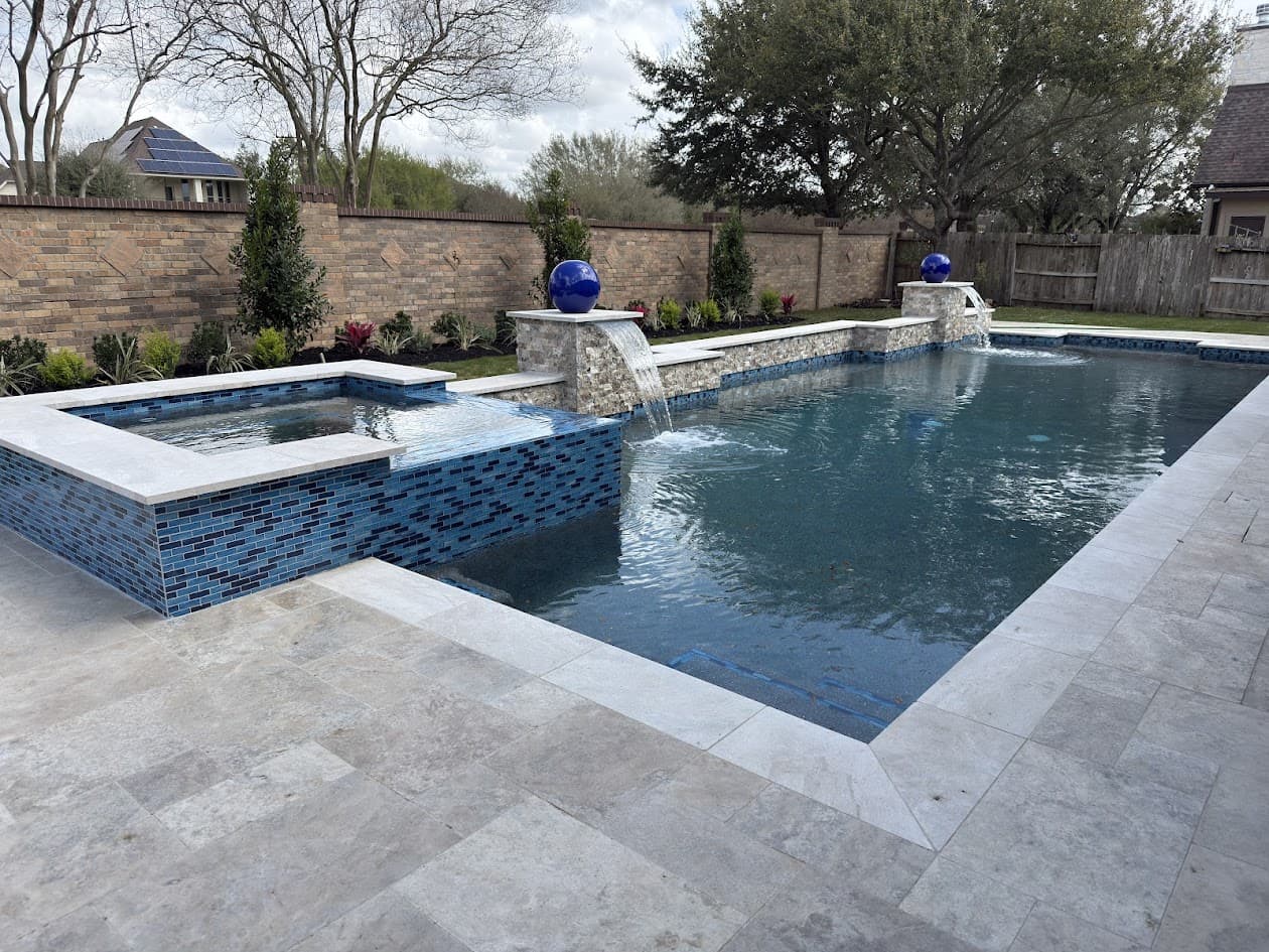 Finished custom pool with spa and water features after new construction