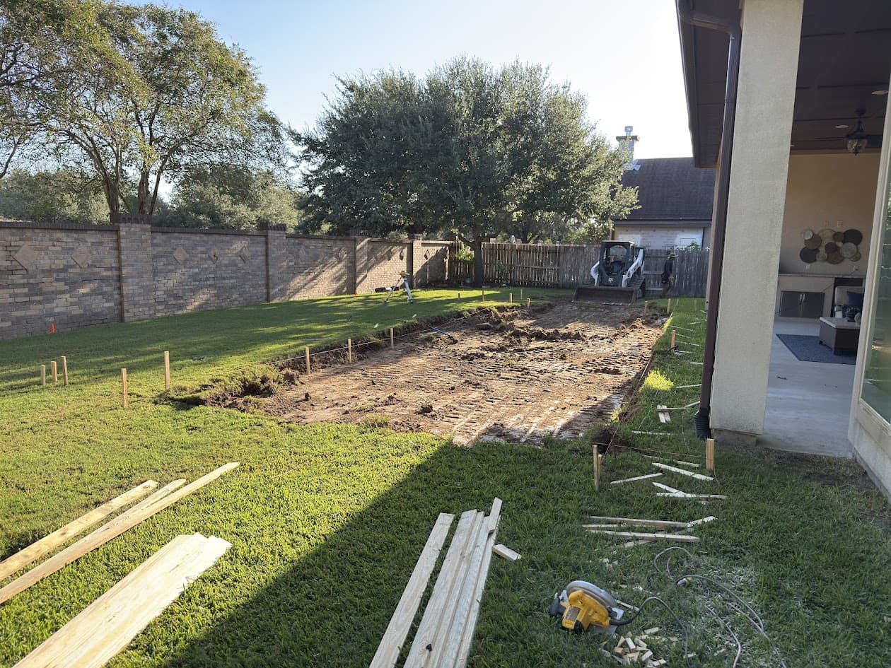 Empty backyard during excavation before new pool construction