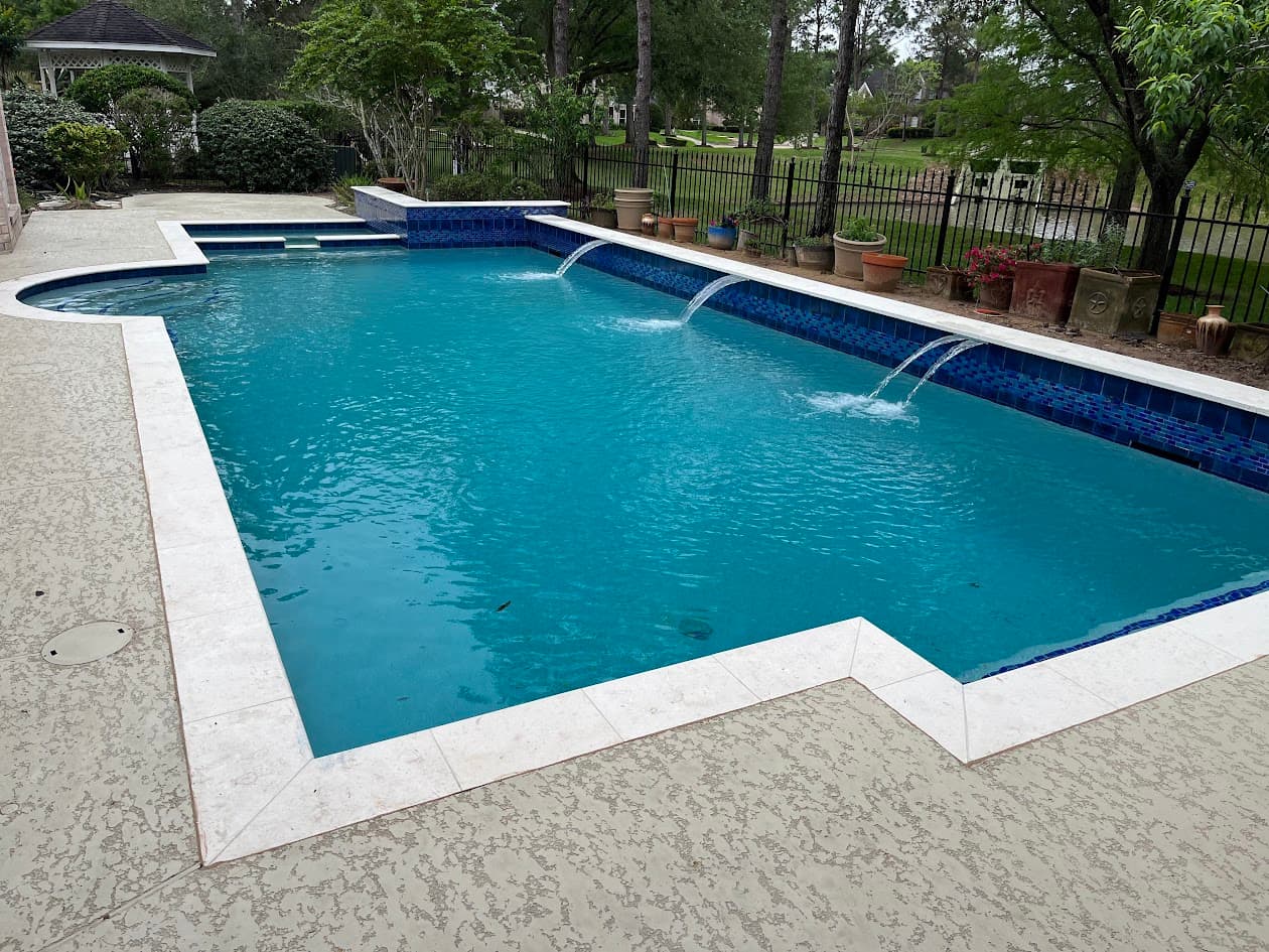 Same pool after renovation with sheer descents and a new gazebo cover