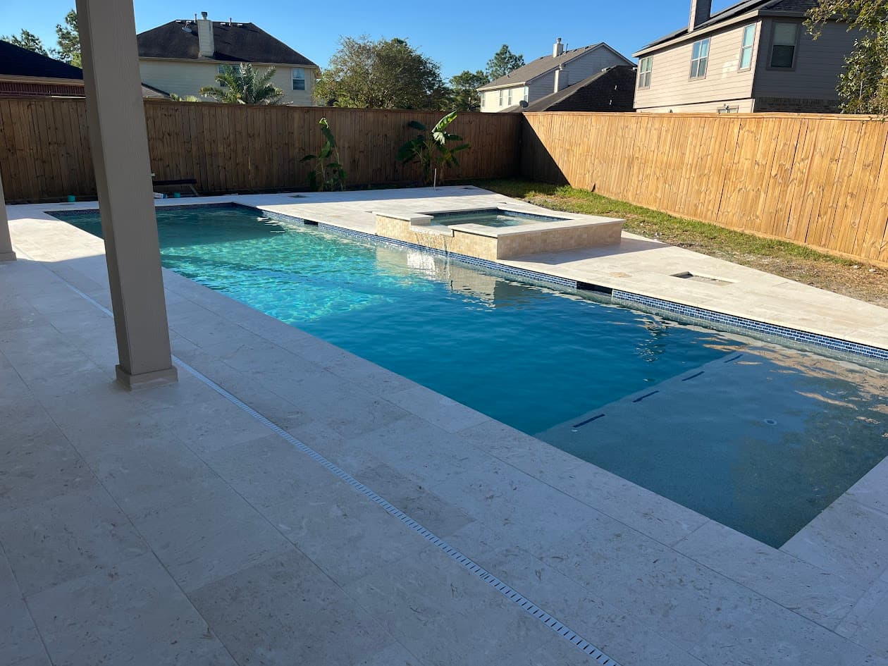 CHR Builder portfolio — custom gunite pool with travertine deck, Katy TX