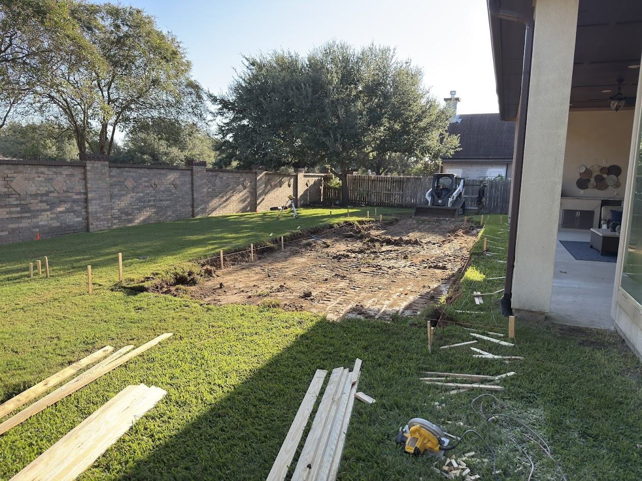 Empty backyard during excavation before new pool construction