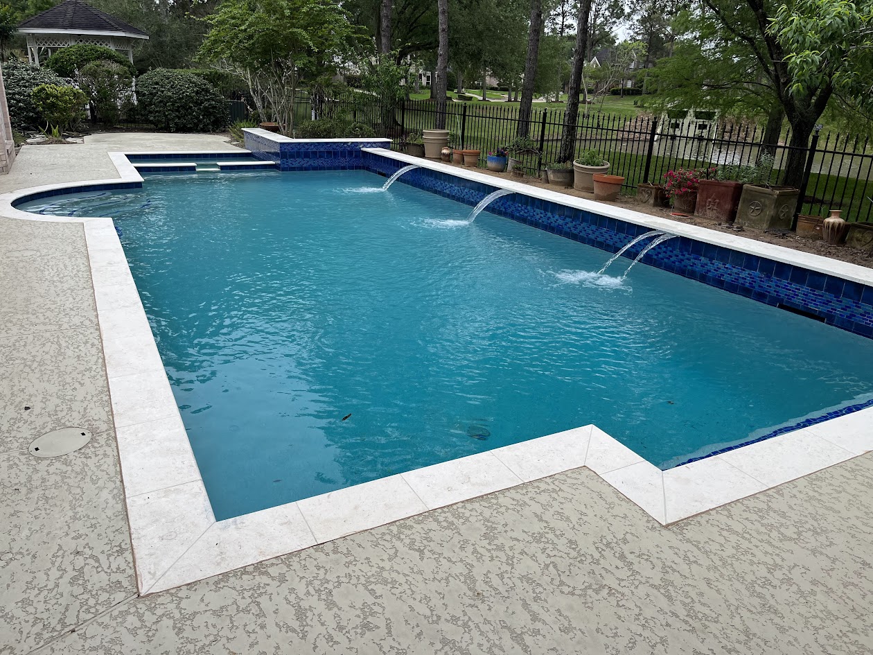 Same pool after renovation with sheer descents and a new gazebo cover