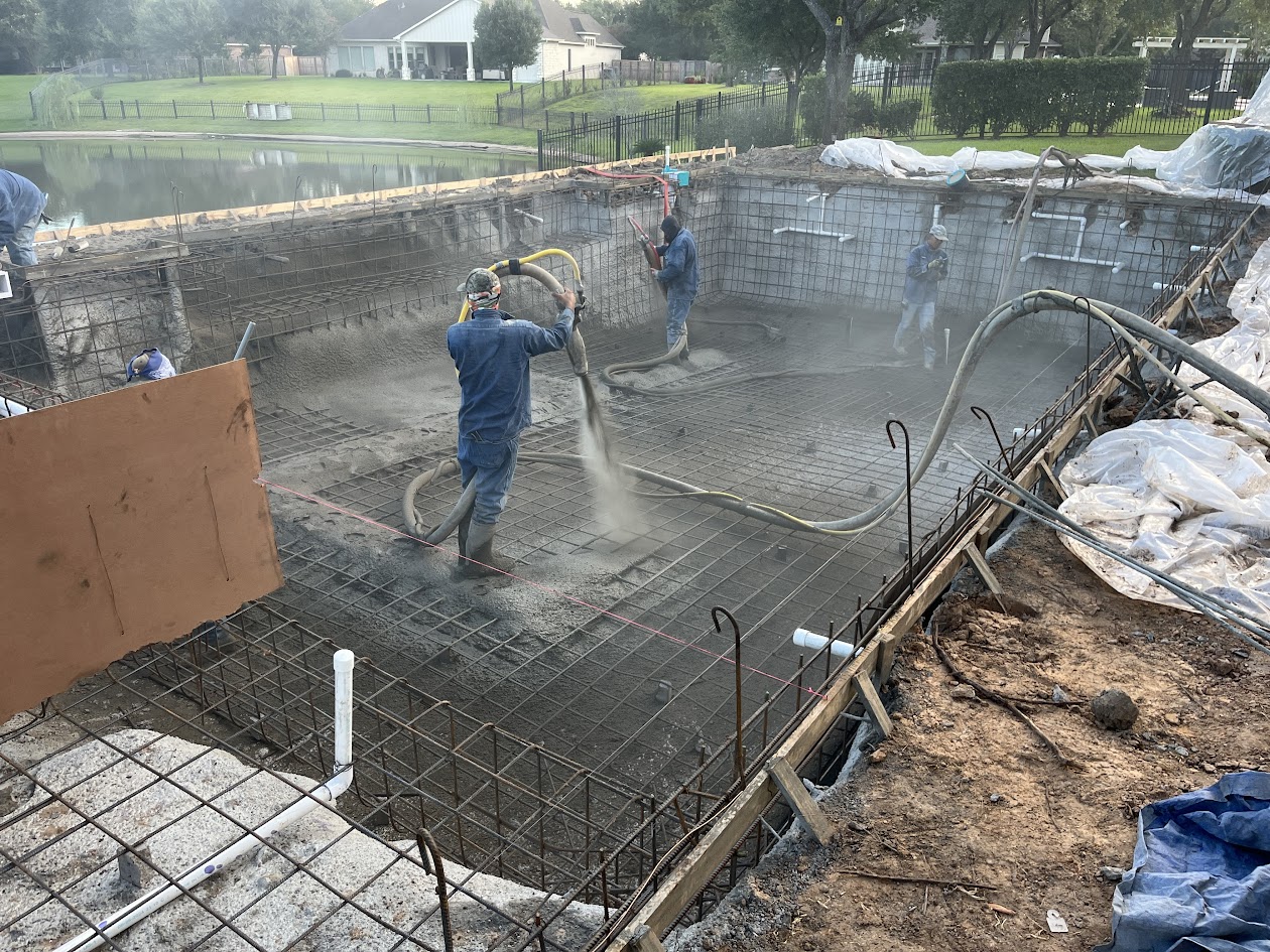 CHR Builder crew applying gunite during new pool construction in Katy TX